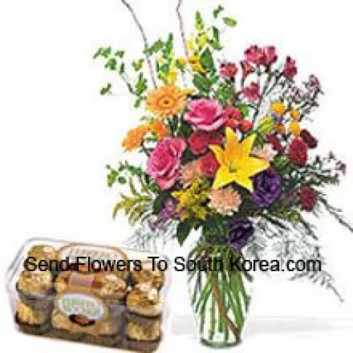 Fleurs assorties dans un vase avec 16 pièces Ferrero Rocher